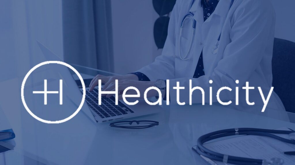 Healthicity Logo on background image of woman in labcoat on laptop